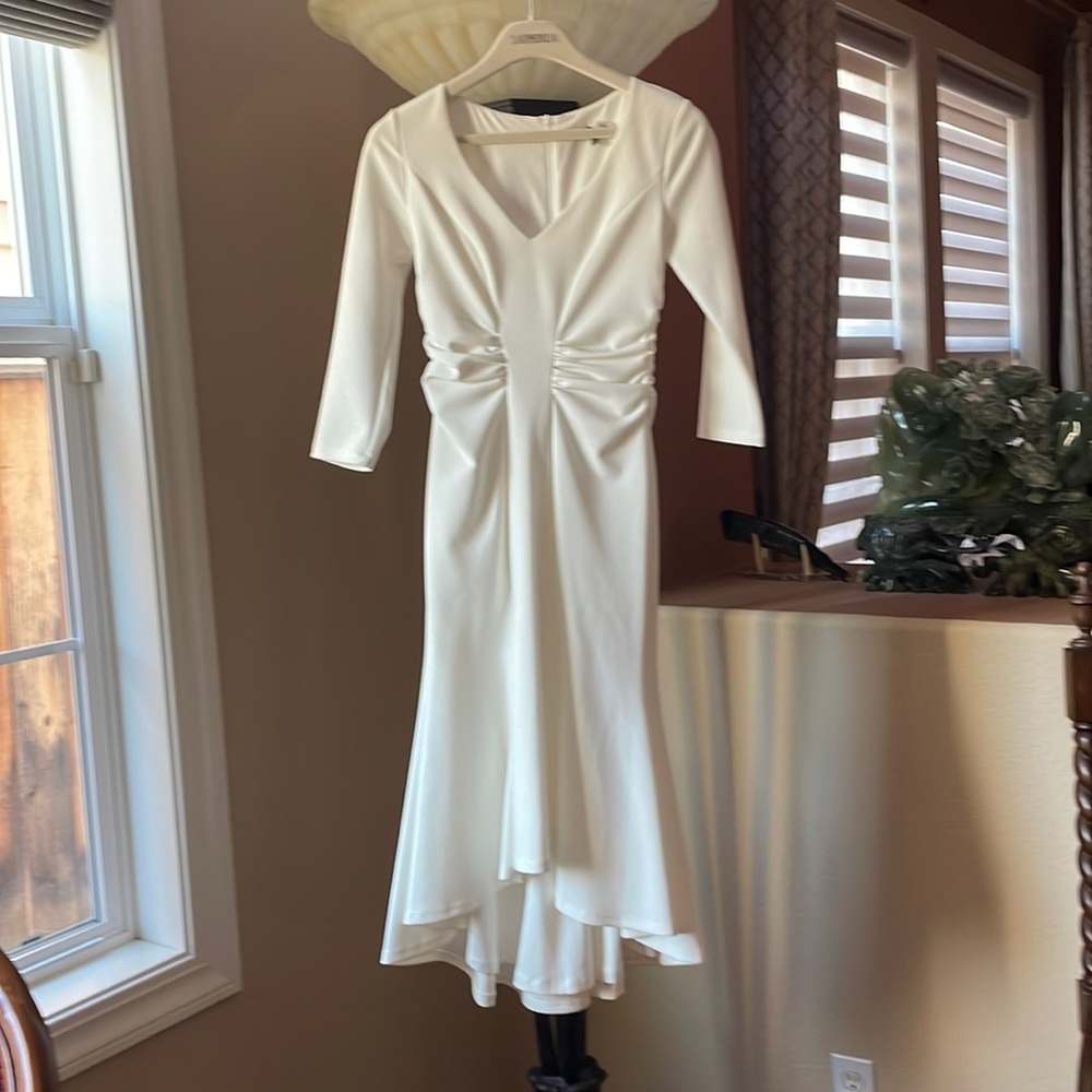 Beautiful elegant white dress with 3-4 sleeves